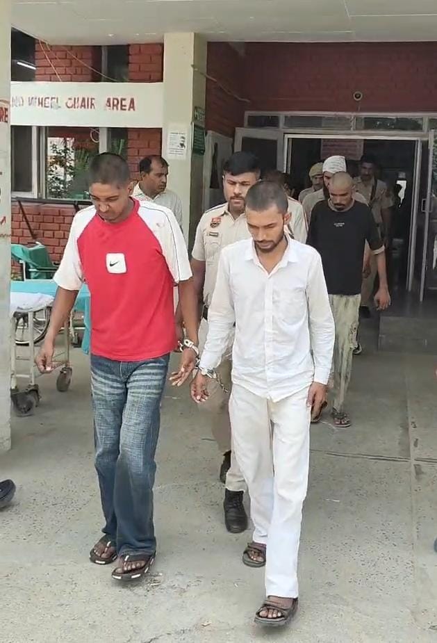 Police parade the six accused involved in the assault and subsequent viral video incident