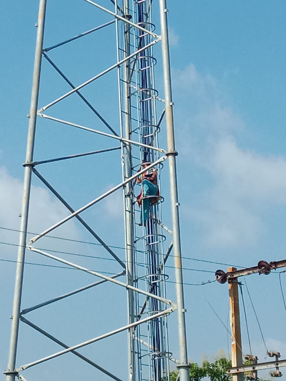 Woman creates a scene after climbing a tower.
