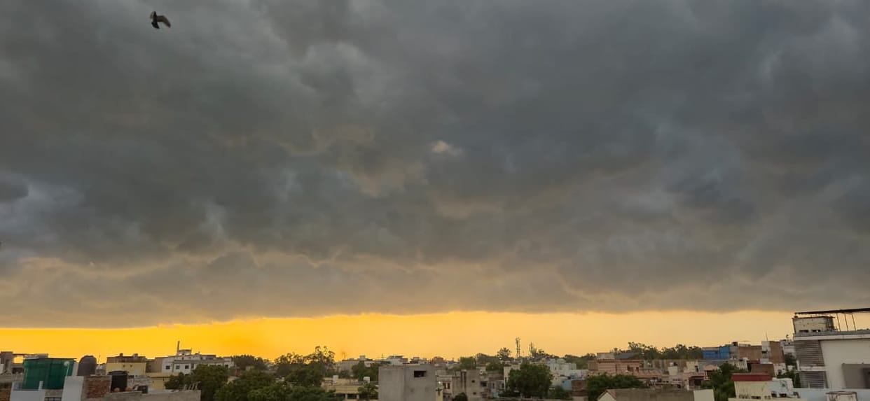 Dark clouds gathered over Bhiwani as evening fell; light drizzle dispelled the humidity.