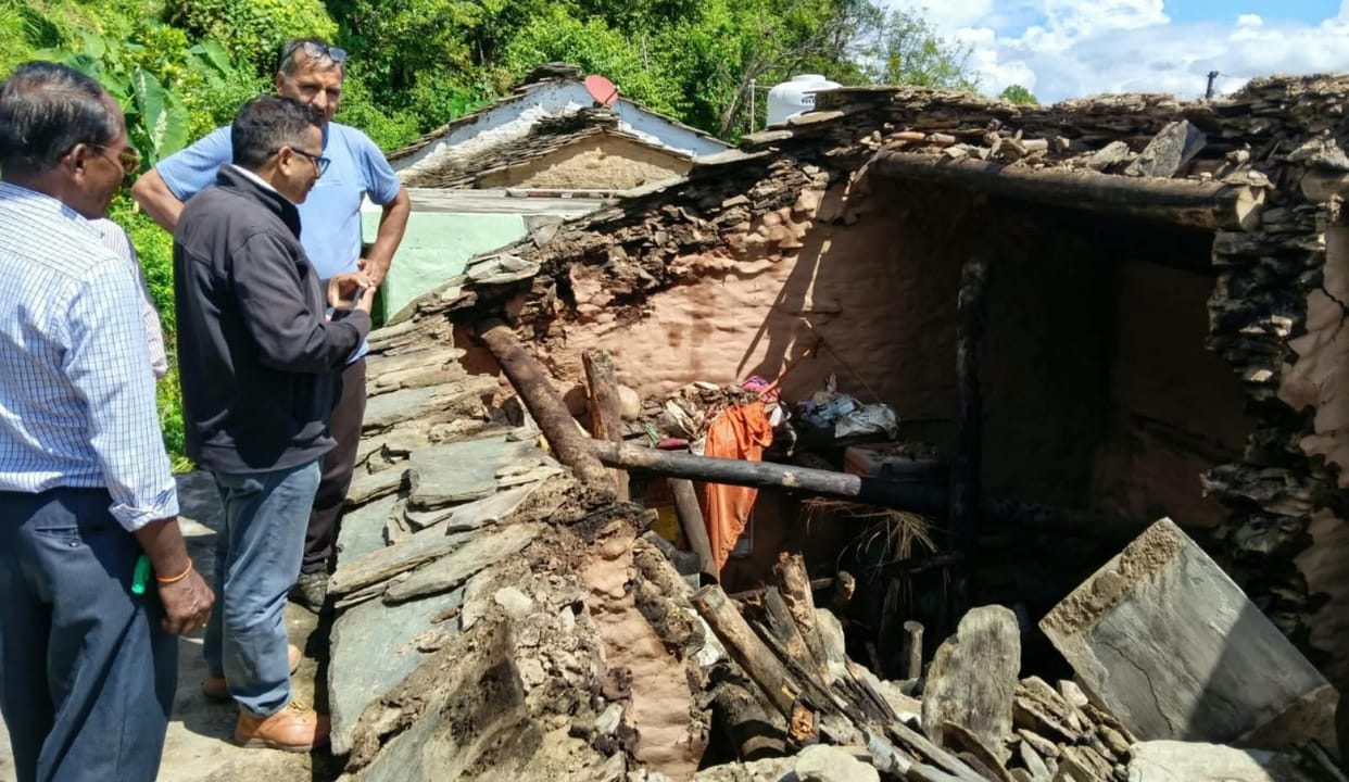 Roof of old building collapses during rain; family escapes to safety.