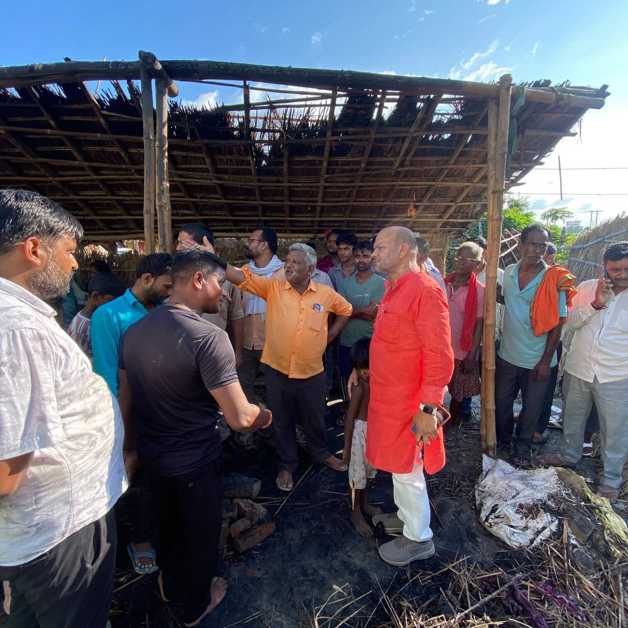 A spark from the stove caused a fire, household items reduced to ashes, and people came forward to help.