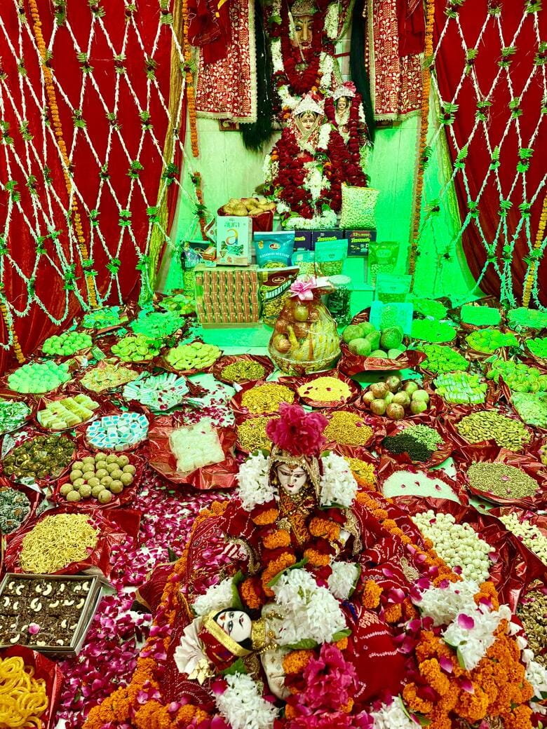 Chhappan Bhog' offered to Rani Sati Dadi; devotees sway to the bhajans.