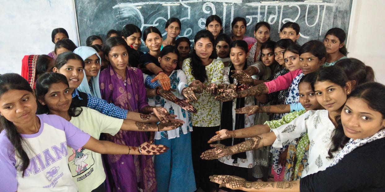 Ruchika takes first place in the Mehndi competition; Neeti and Jyoti share second place.