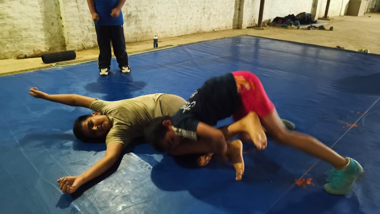 National-level wrestlers training at the sports nursery in Titauli village.