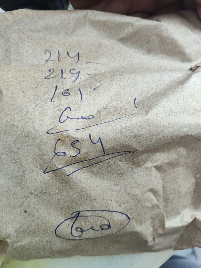 Bill missing; calculation scribbled on the medicine envelope.