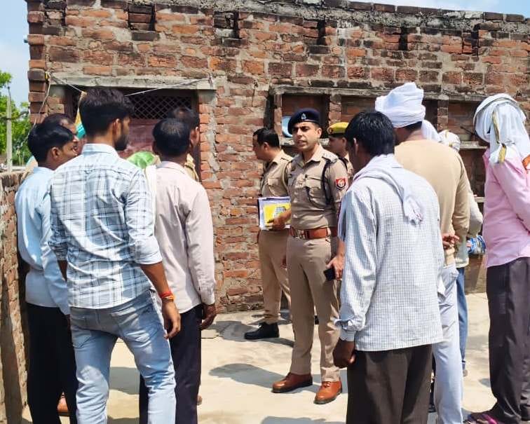 Woman's body found hanging; murder alleged.