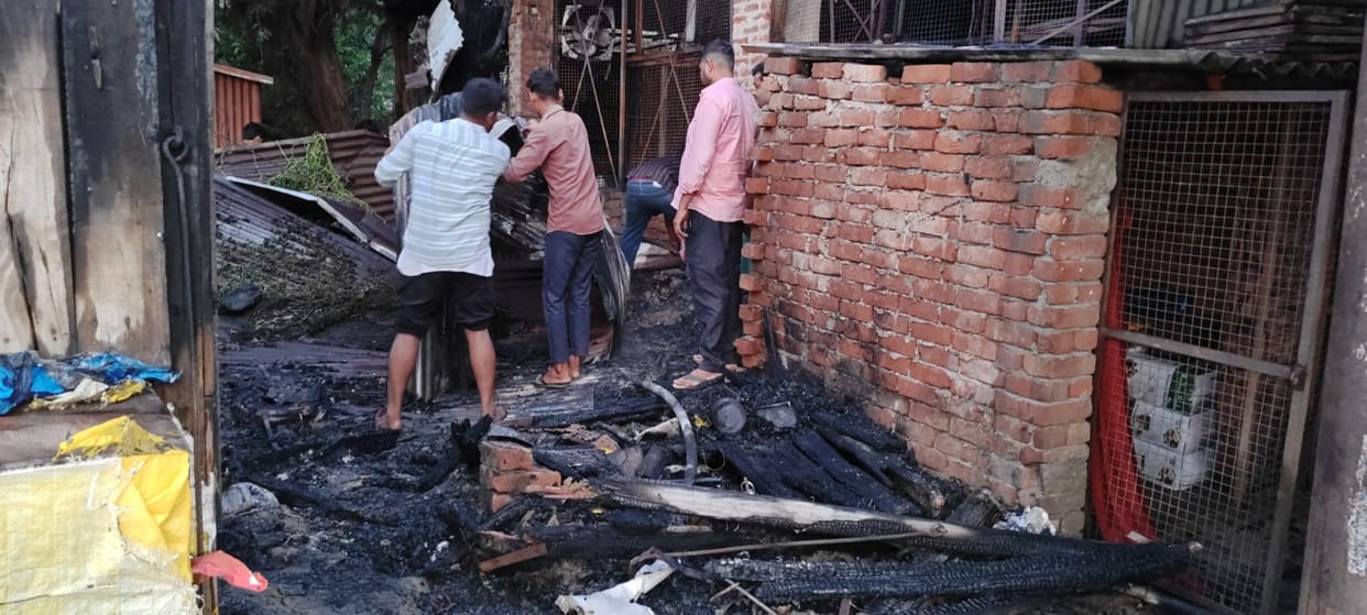 Fire breaks out in three shops due to a short circuit; goods worth thousands destroyed.