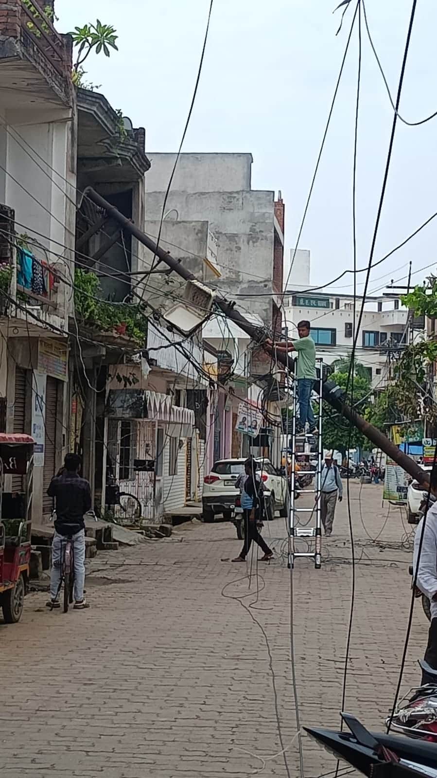 Dilapidated electricity pole falls on house; power out for two hours.