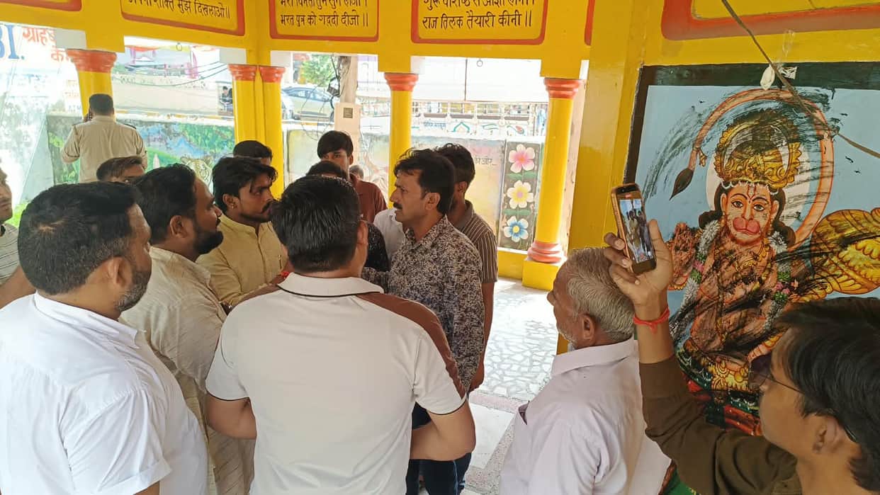Smeared soot on images of deities after failing to receive payment.