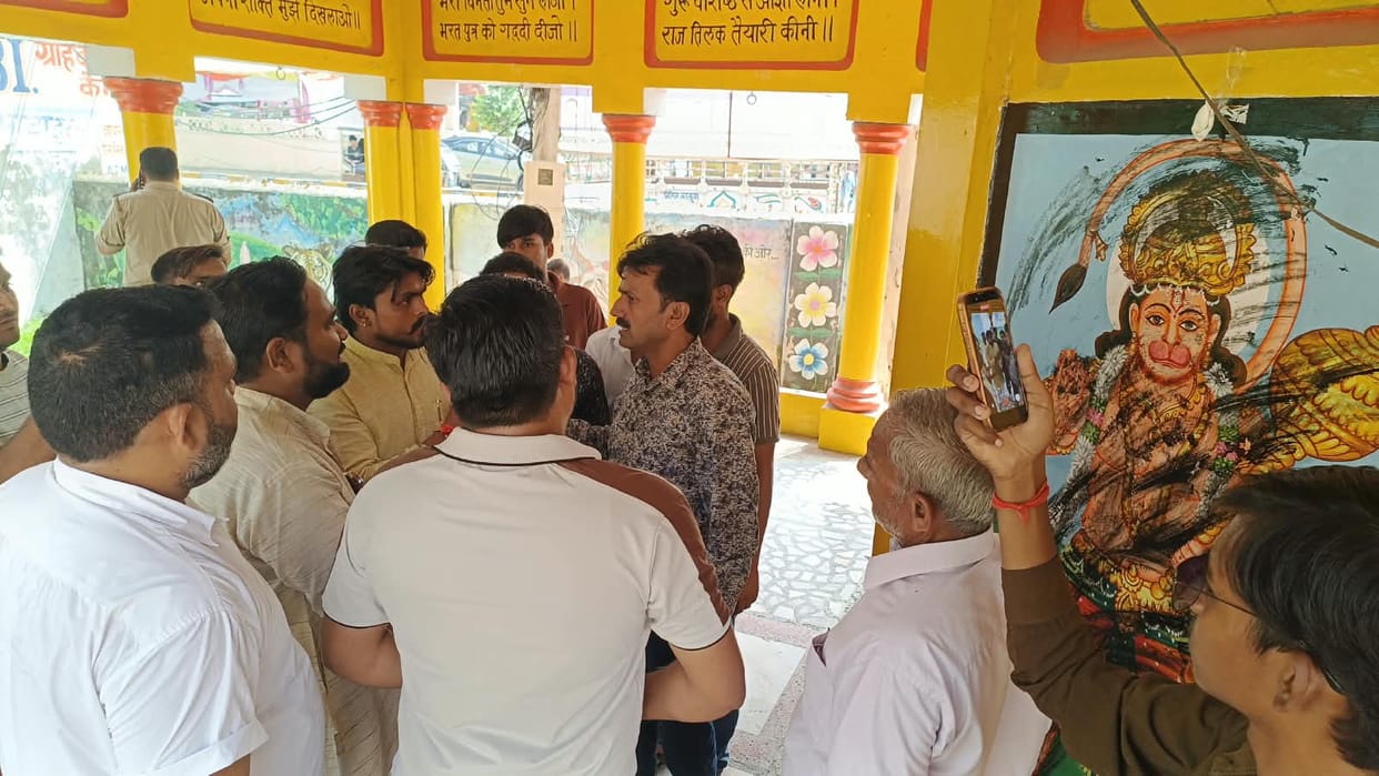 Smeared soot on images of deities after failing to receive payment.