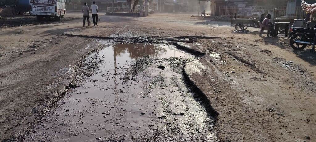 The road at Devilal Chowk lost amidst potholes.