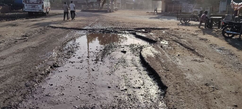 The road at Devilal Chowk lost amidst potholes.