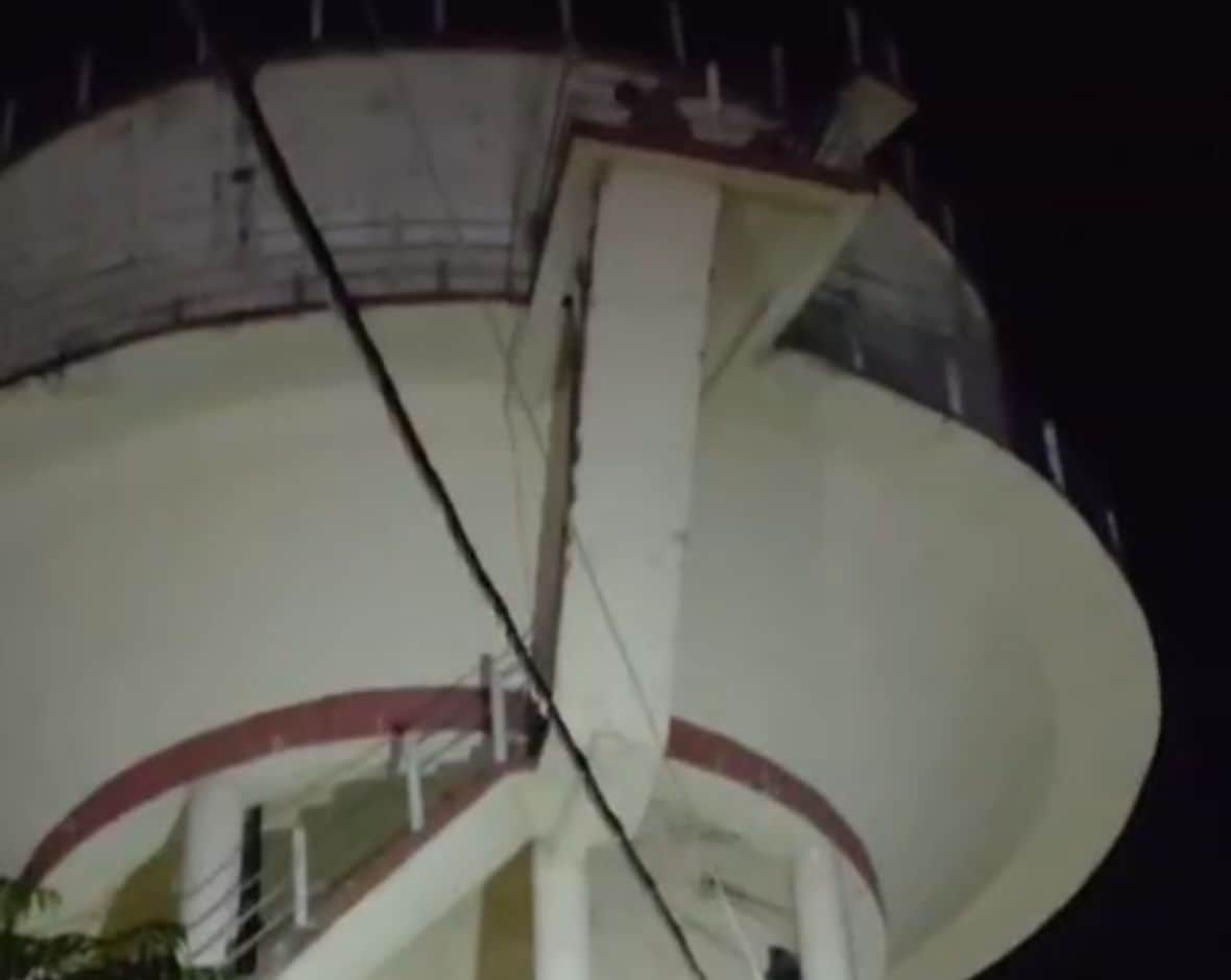 Young man climbs water tank after being scolded