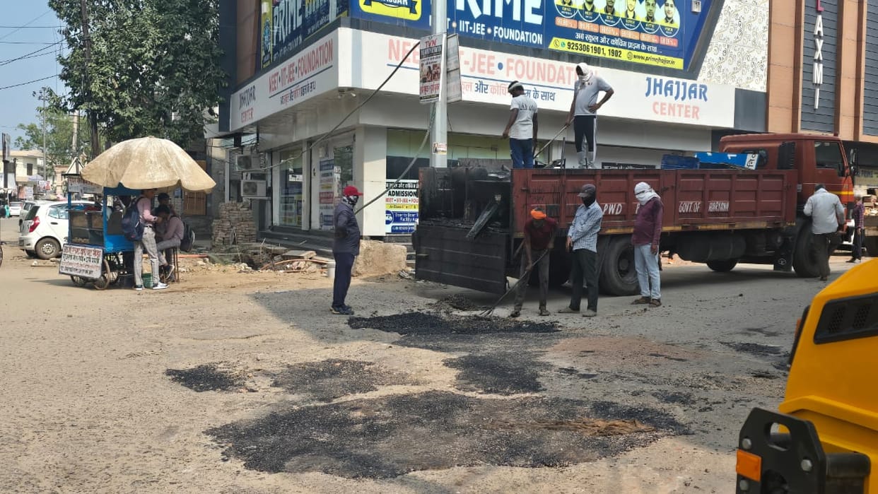 Deep potholes had formed on the roads due to the rain; patchwork repairs
