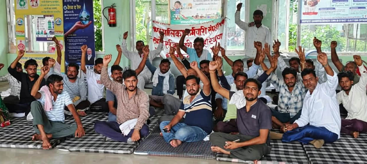 Sanitation workers' union dismisses agreement as a 'lollipop'; warns of renewed agitation.