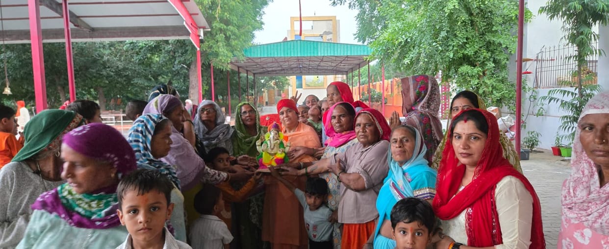 A procession was taken out with singing and dancing to devotional songs.