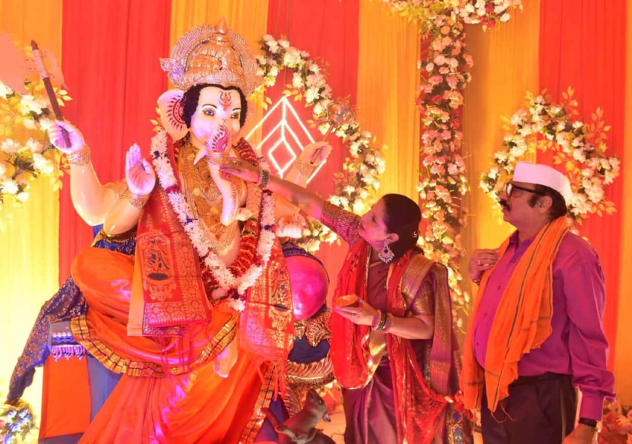Praying to Lord Ganesha for prosperity.