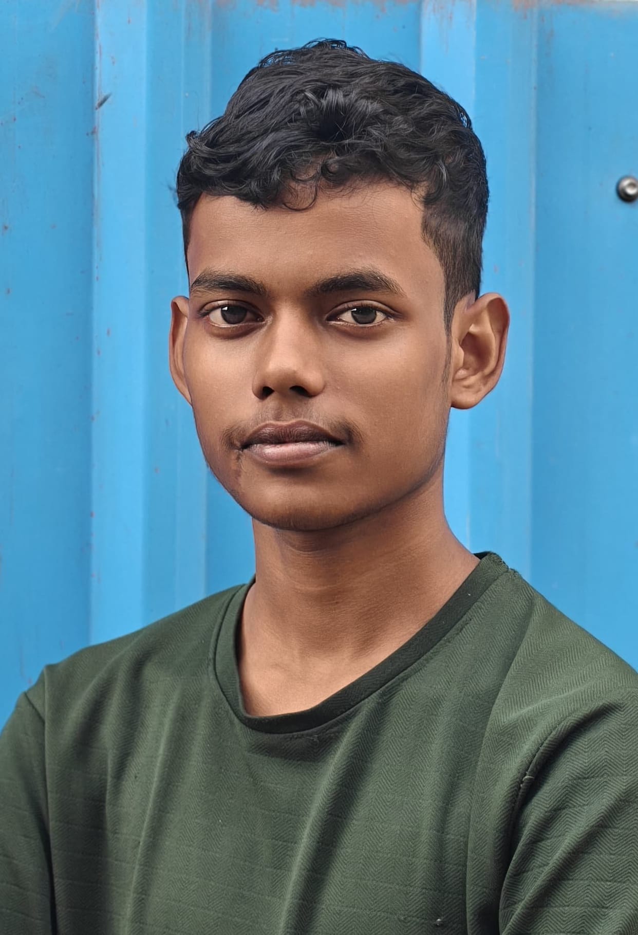 Teenager dies after coming into contact with live electric pole.