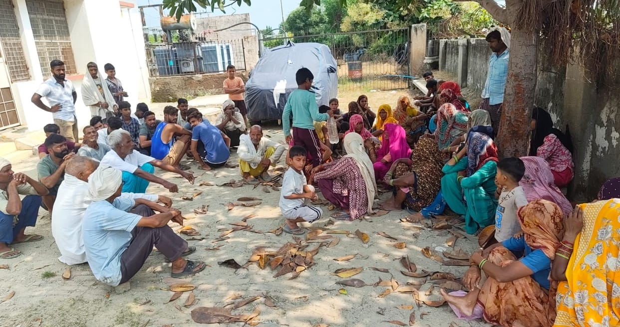 10-year-old girl suffers burns after coming into contact with high-tension line; villagers surround power substation.