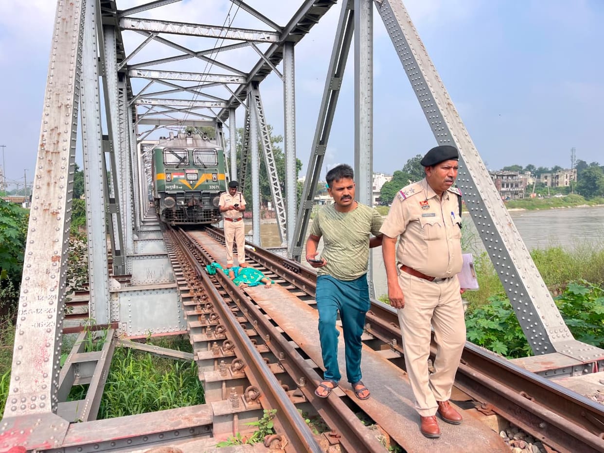 Woman killed, two children injured after being hit by a train on a railway bridge