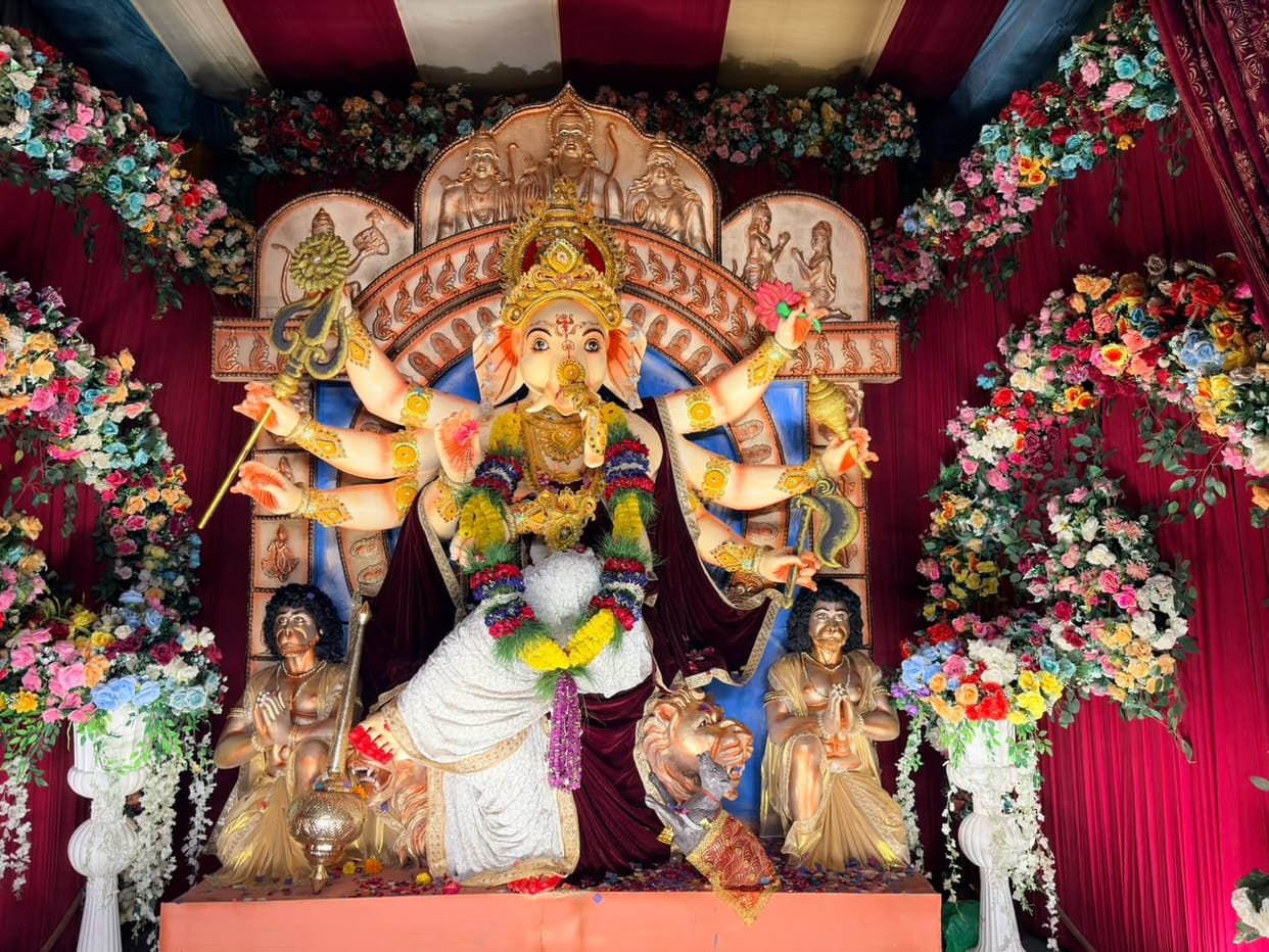 Ganpati enshrined in pandals; chants of 'Bappa' fill the air.