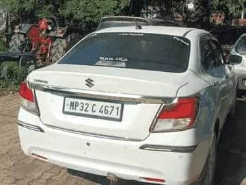 A car was stopped on the Jhansi bypass and firing took place. Two bullets pierced the windshield