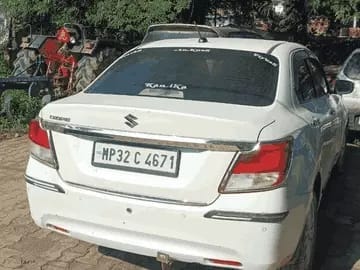 A car was stopped on the Jhansi bypass and firing took place. Two bullets pierced the windshield