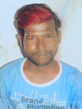 Laborer's body found hanging from a tree by a rope noose.