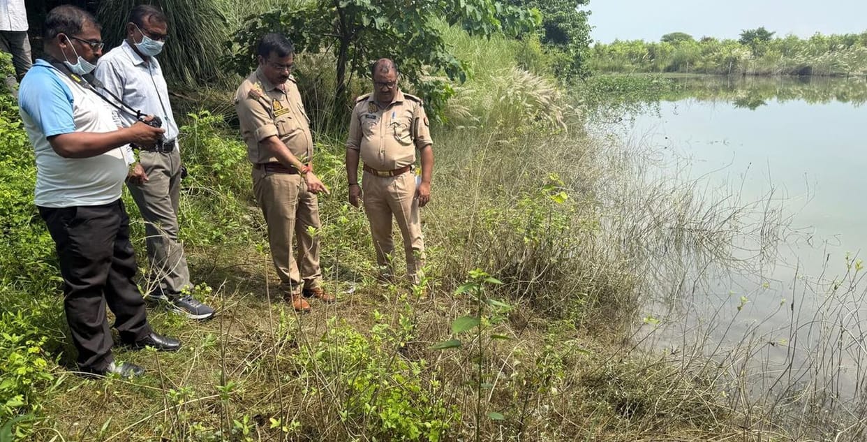 Woman murdered by having her throat slit; body found in water-filled pit