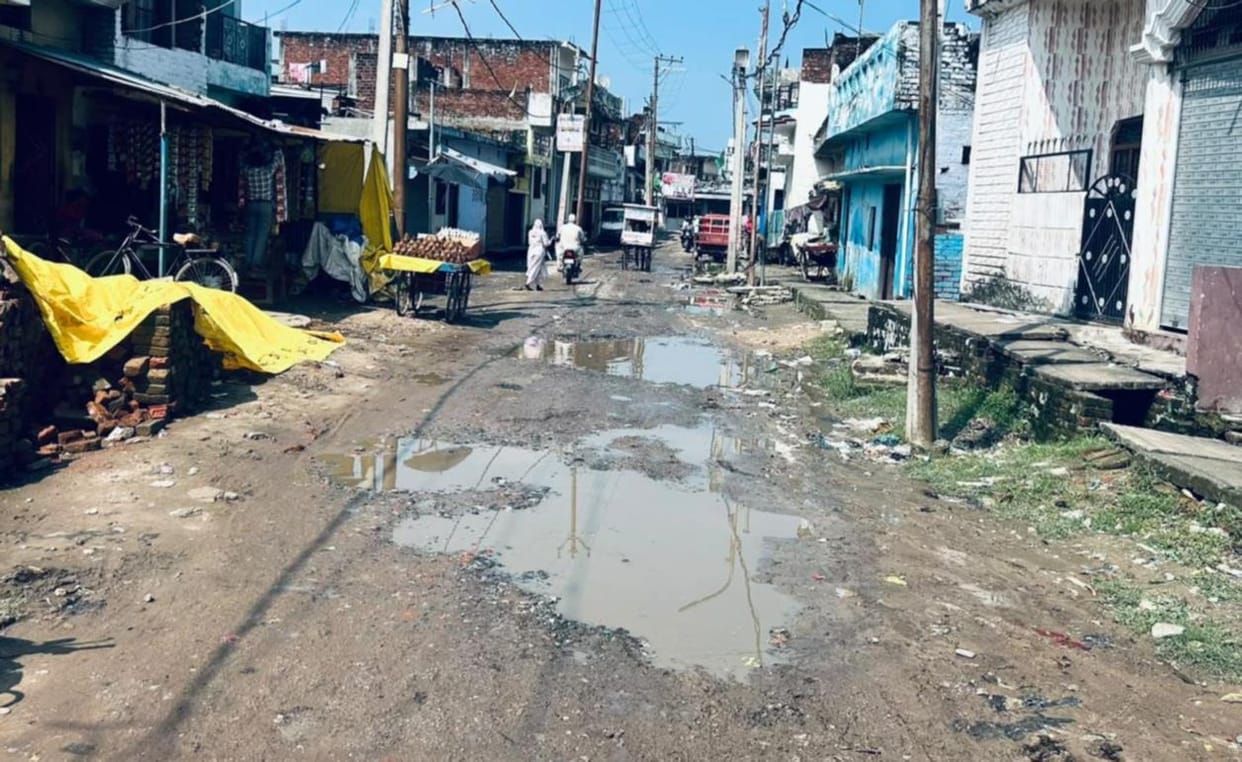 Potholes on the roads, people being jolted about.