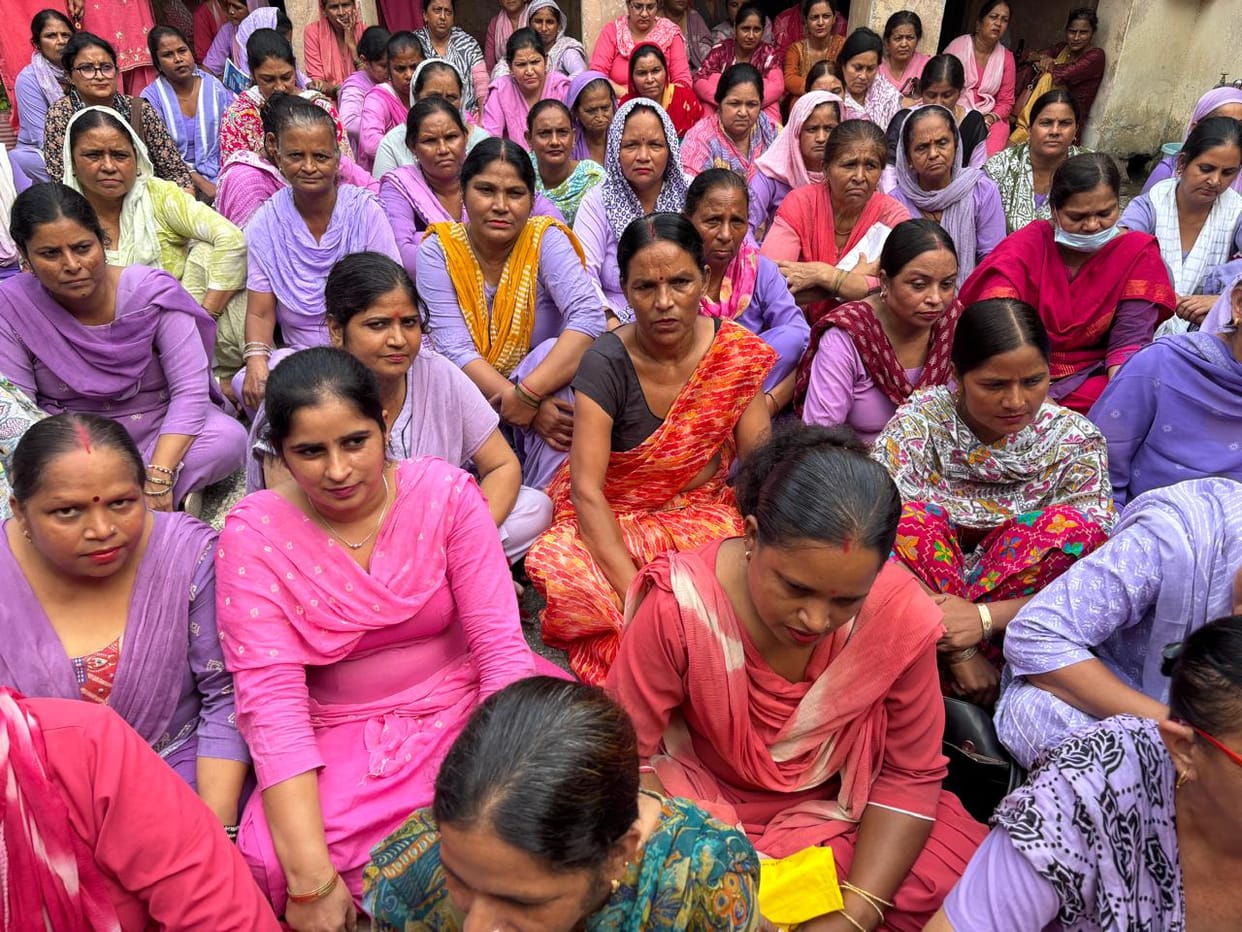 Anganwadi workers on protest; raw rations being served to children.
