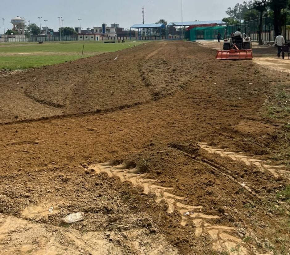 A 100-meter running track is being prepared at the sports stadium.