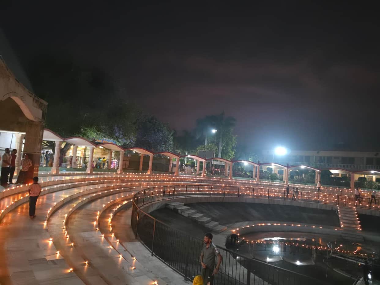 Industrial city illuminated by lamps of blessings.