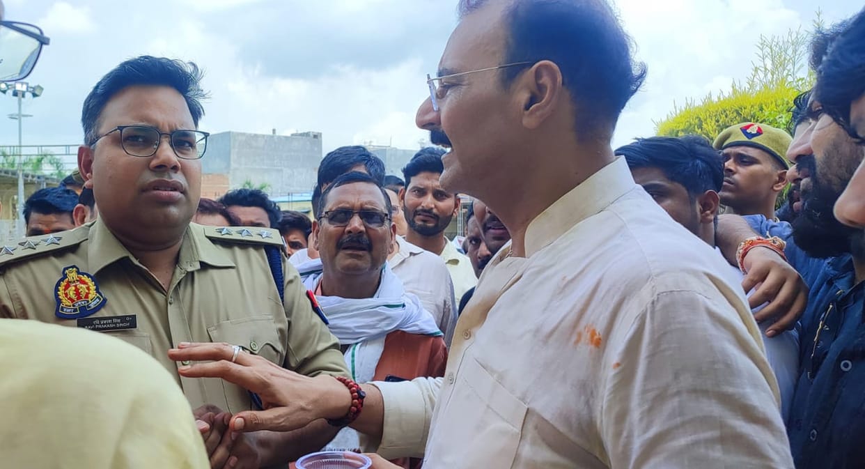 BJP members create a ruckus over the stopping of a procession on the PM's birthday.