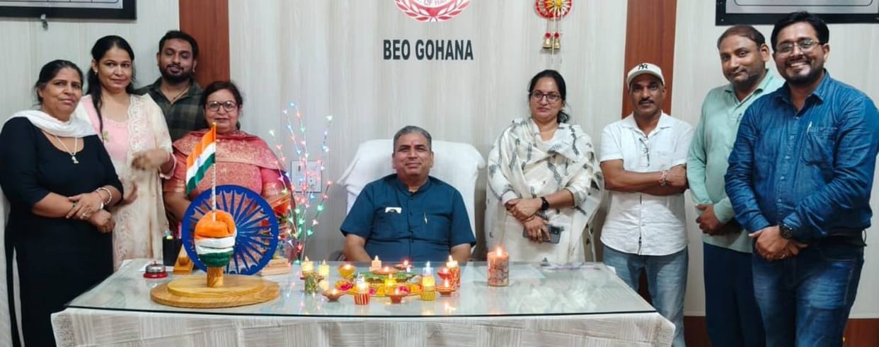 The BEO and staff lit lamps of blessings in the office.