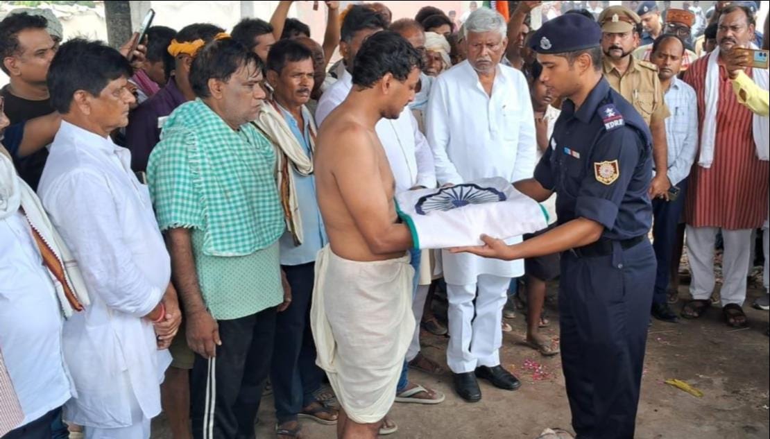 Final farewell with state honors; son performed the last rites.
