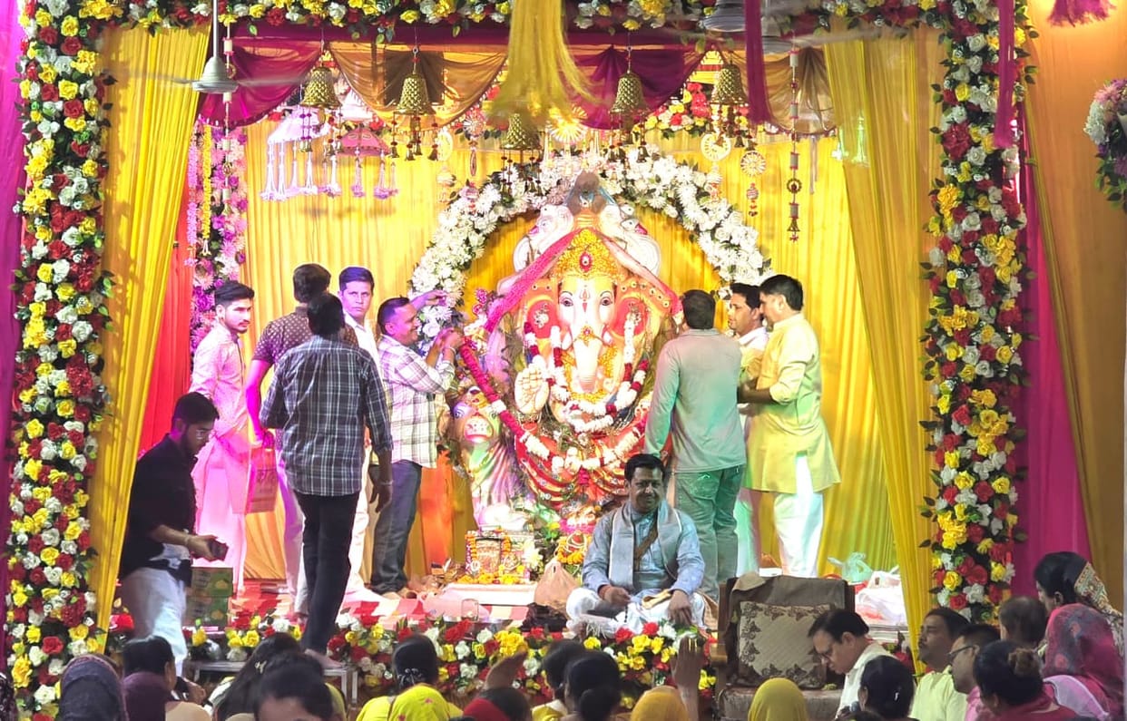 Bhajans resonate at the Ganpati festival; devotees sway in devotion.