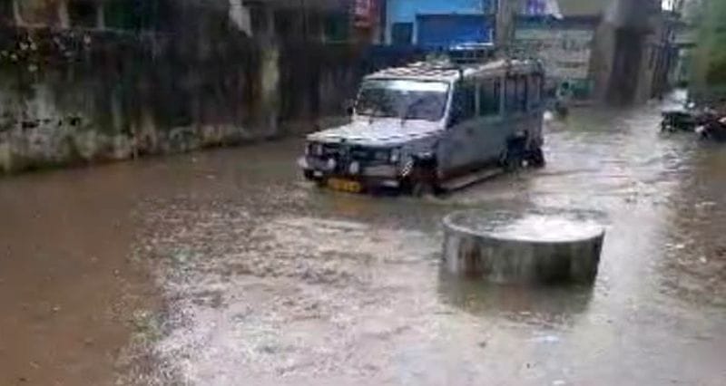 Heavy rain leaves roads waterlogged; water enters homes and shops.