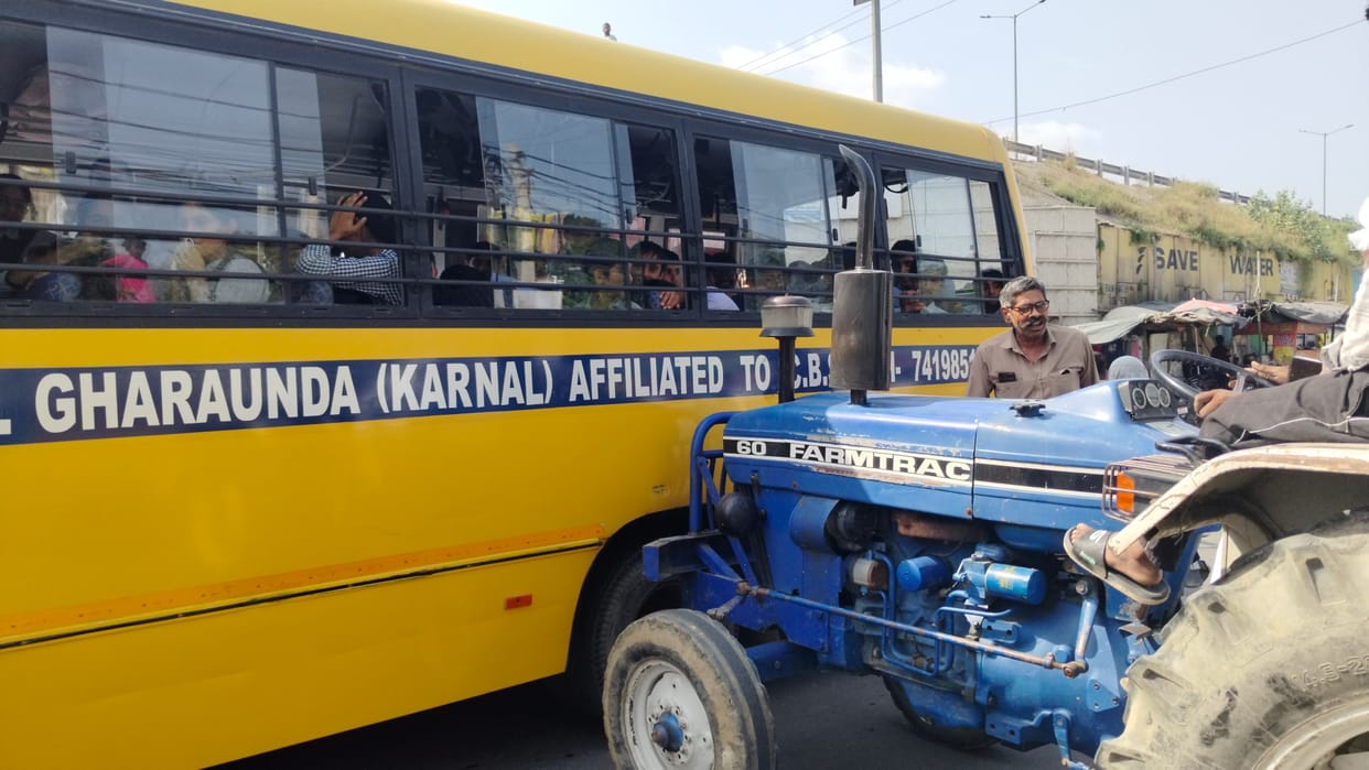 Tractor-trolley hits school bus.