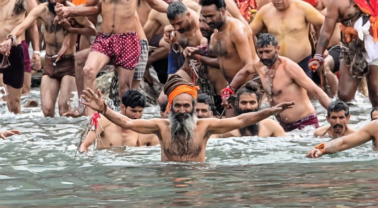 Devotees immersed in devotion while singing hymns dedicated to Lord Shiva.