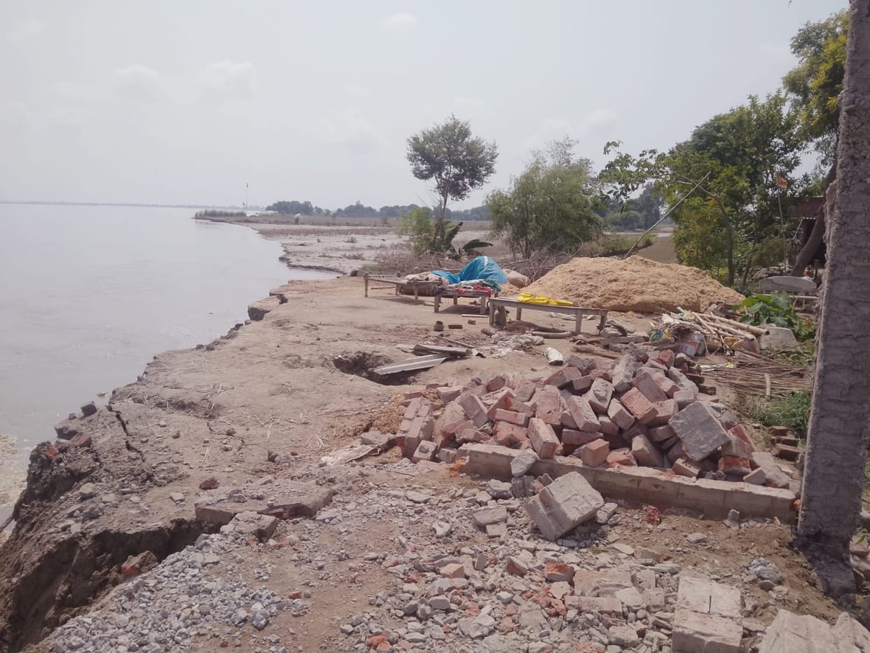 Erosion: Four houses swallowed by the river during the floods; road washed away; population of 20,000 affected.