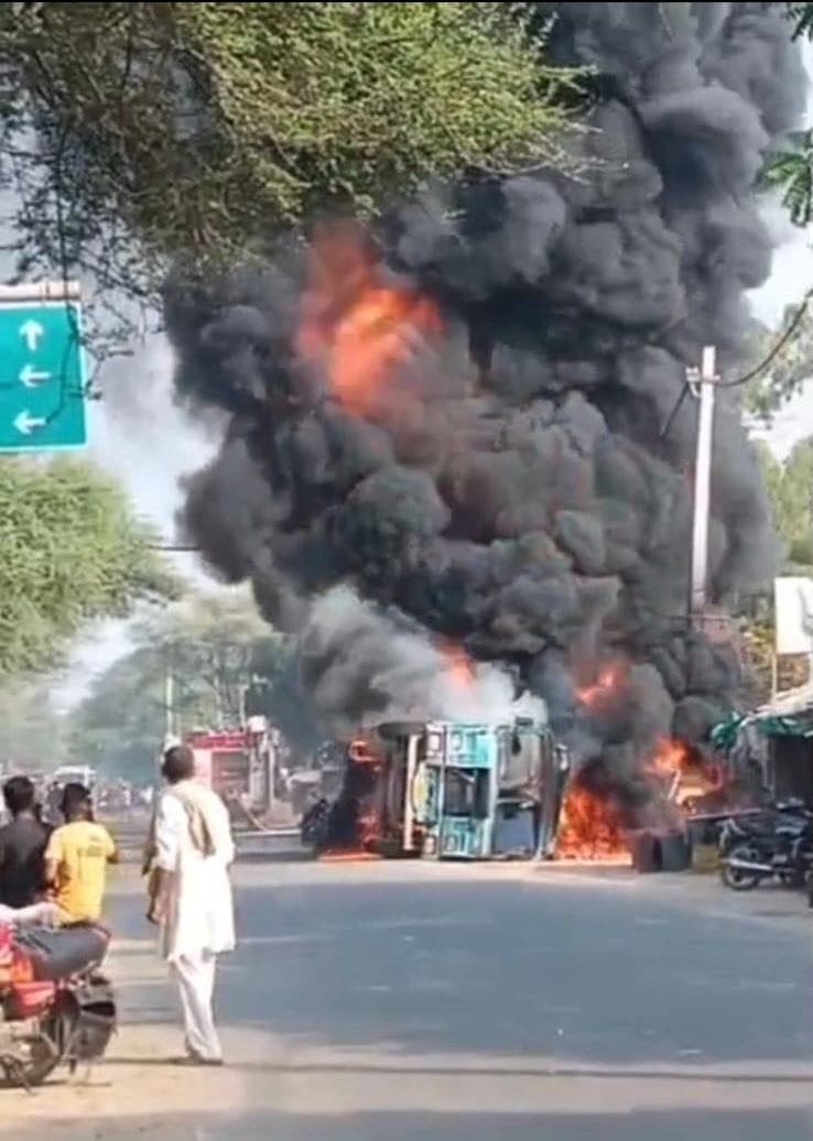 Chemical-laden tanker overturns; leak sparks fire.