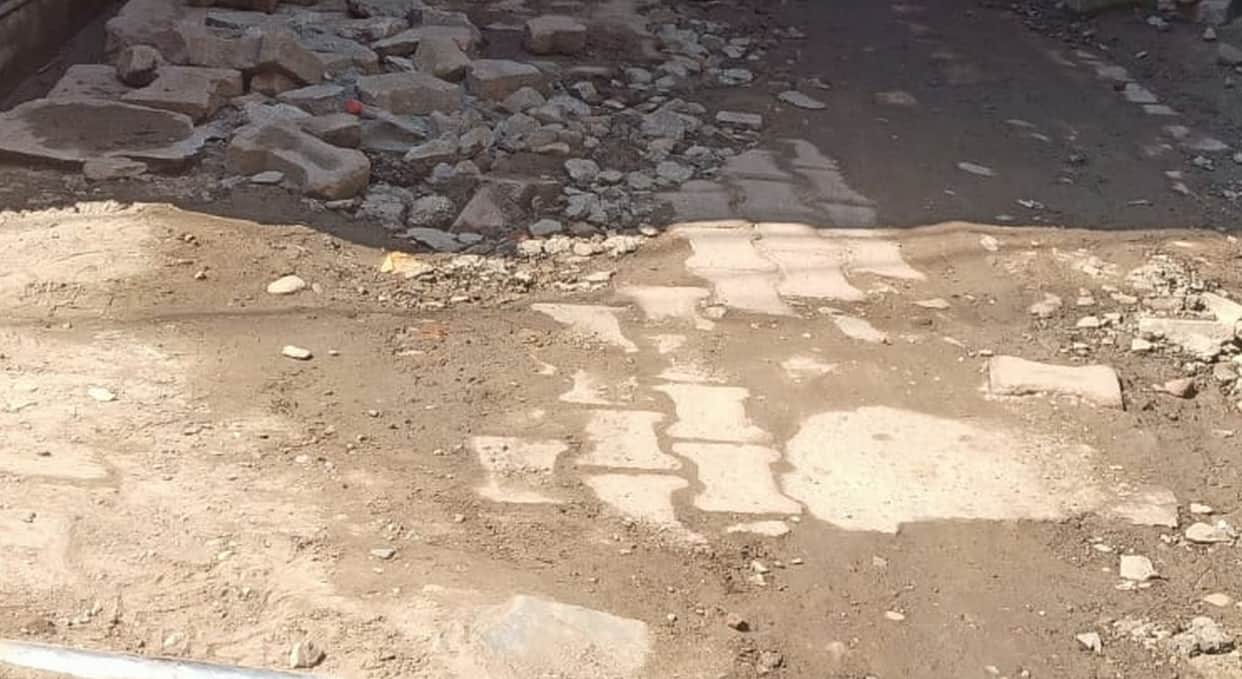 The very first rain exposed the layer of pavers.