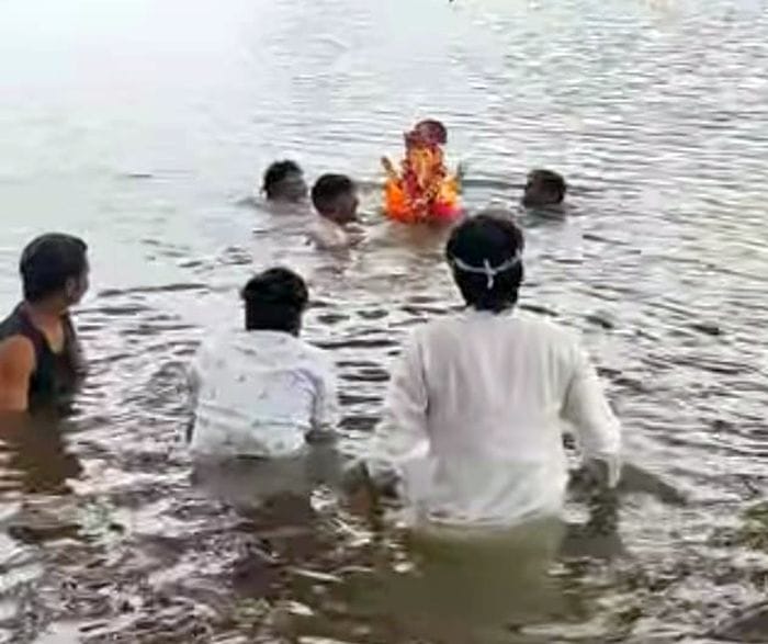 Ganesh idols immersed with teary eyes.