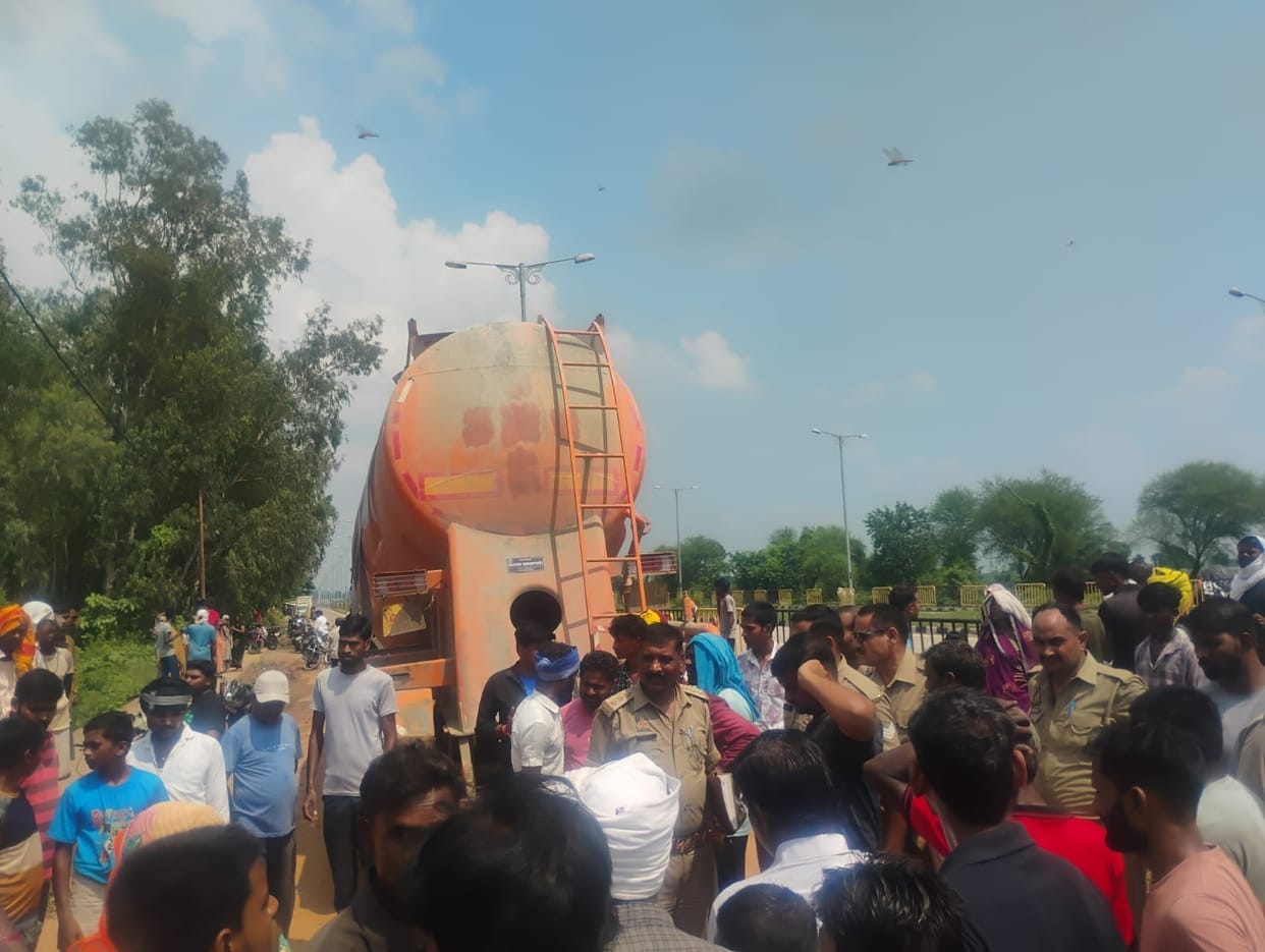 Woman crushed to death by cement-laden bulker; husband injured.