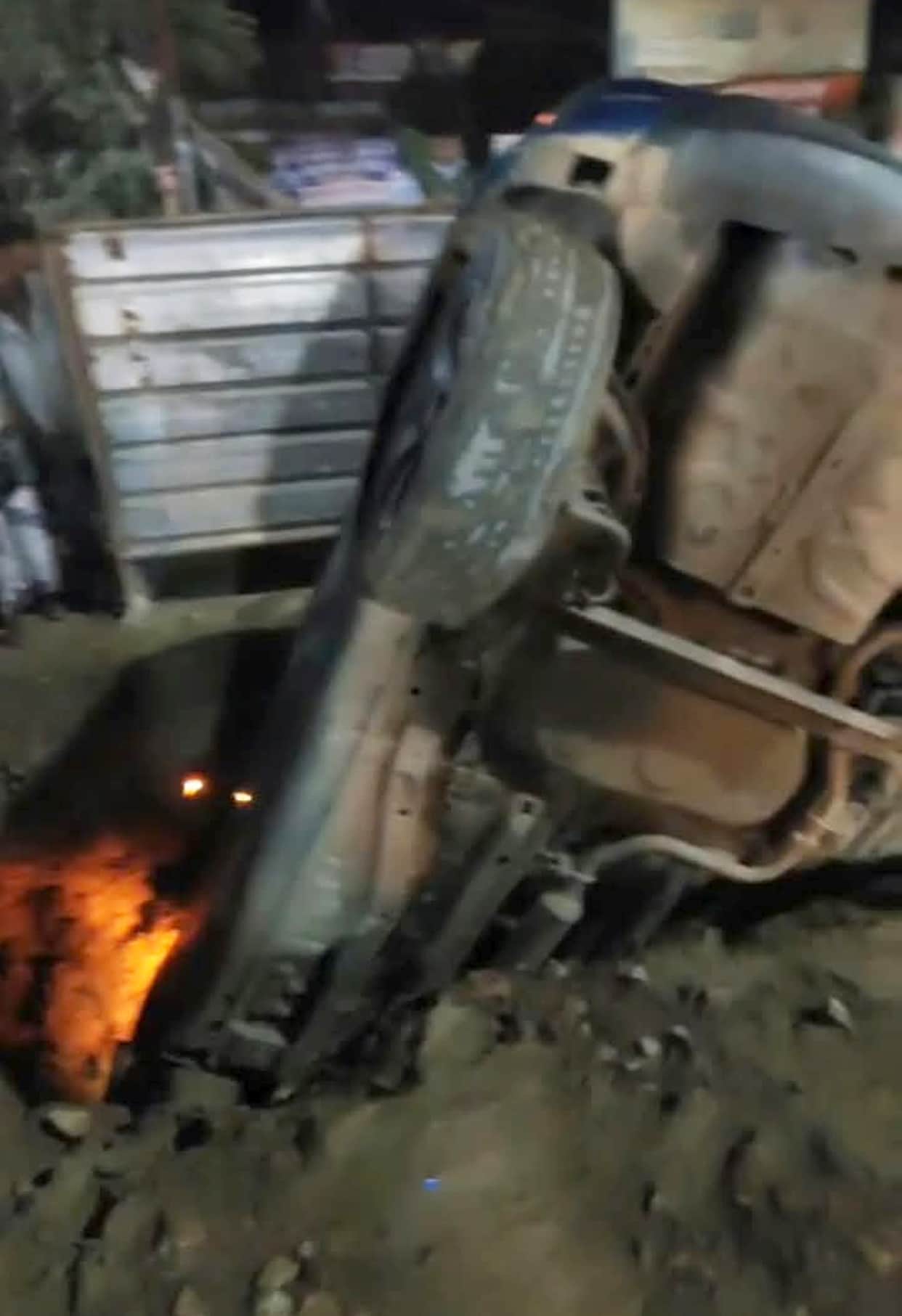 Car plunges into foundation pit; family saved.