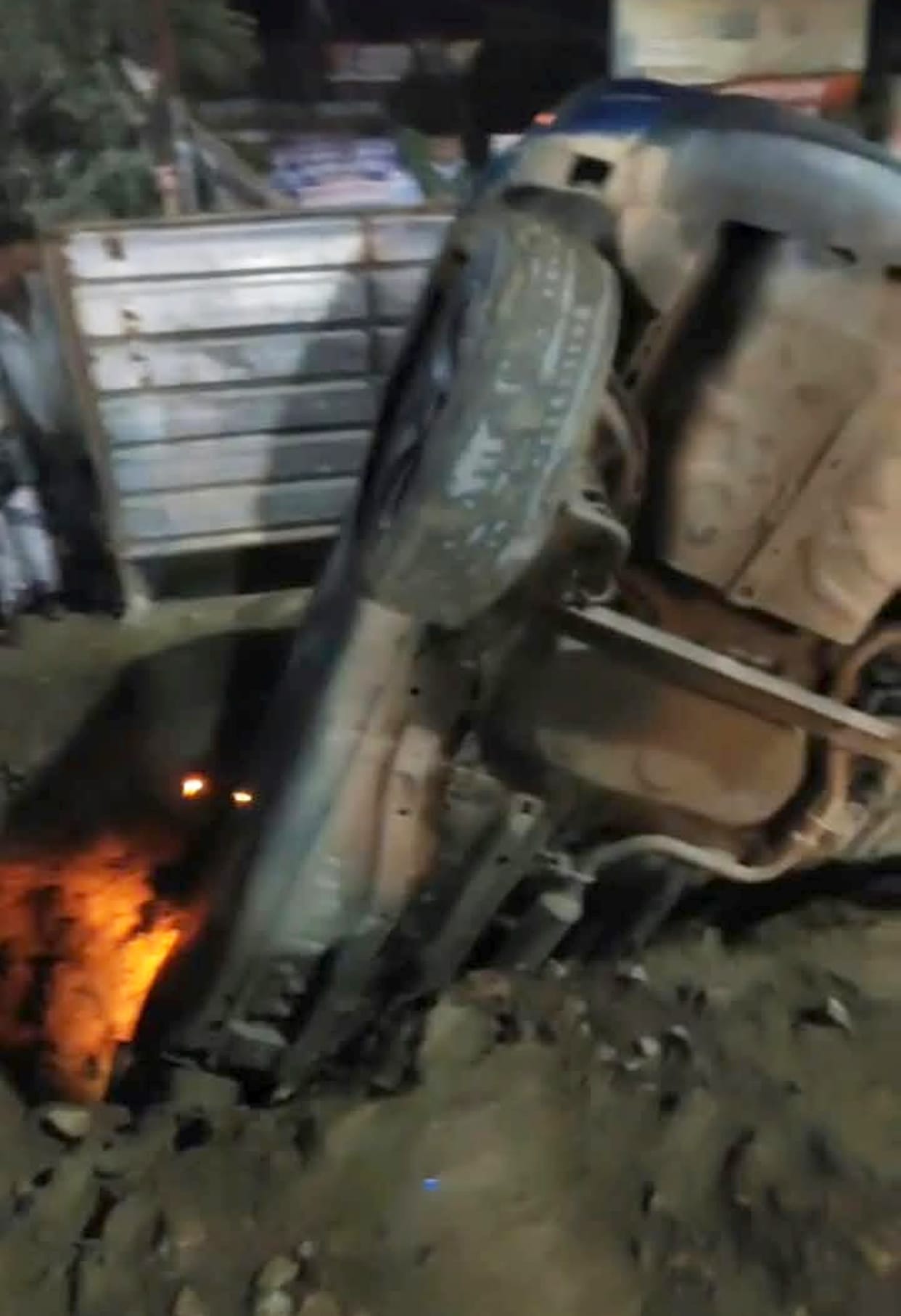 Car plunges into foundation pit; family saved.