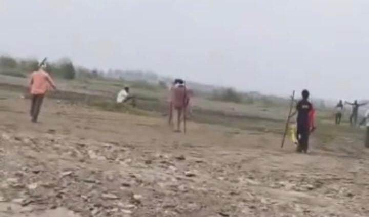 Two groups clash over land encroachment in Yamuna Khadar; weapons brandished.