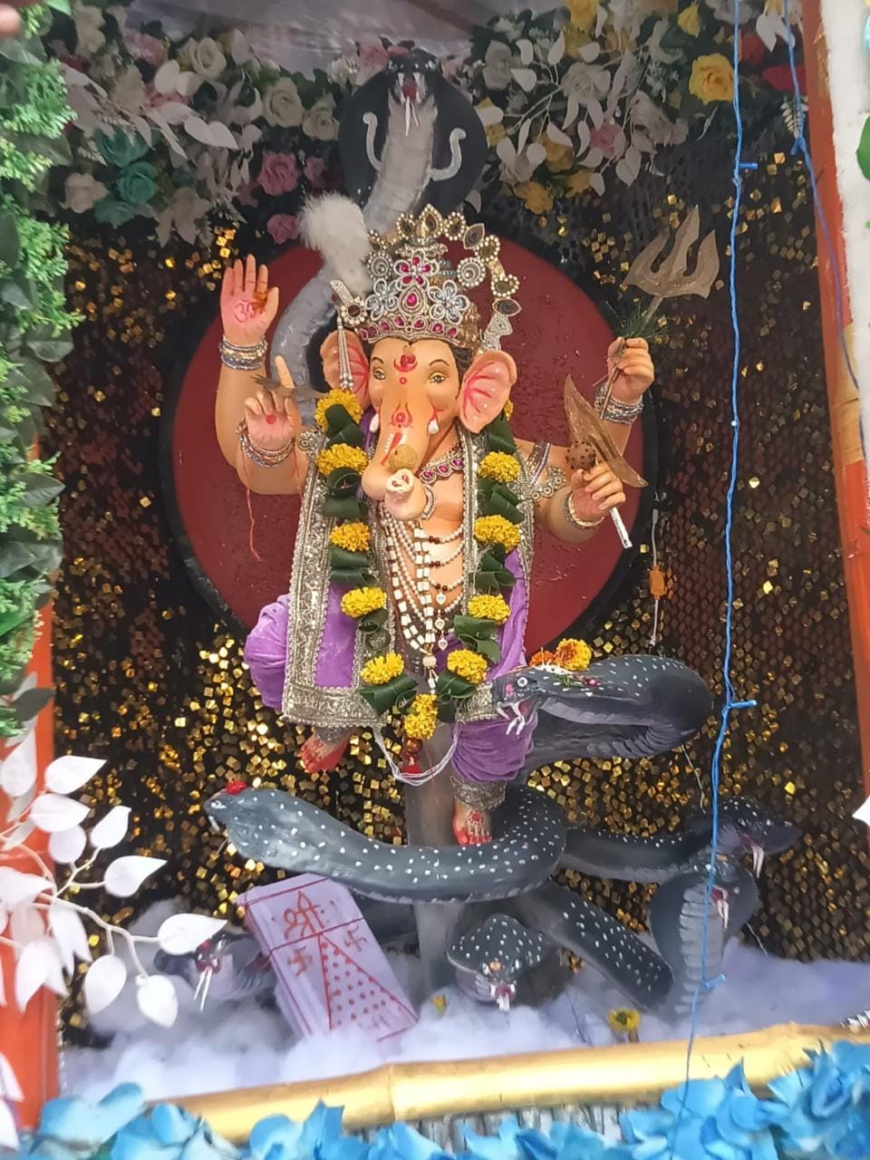Youths set up a grand tableau of Lord Ganesh on the banks of the Amjhar River.