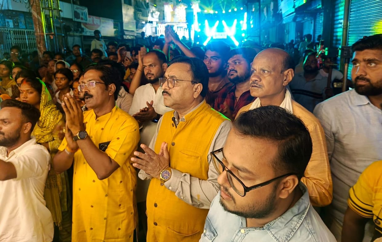 Devotees throng the immersion procession of Krishna and Radha